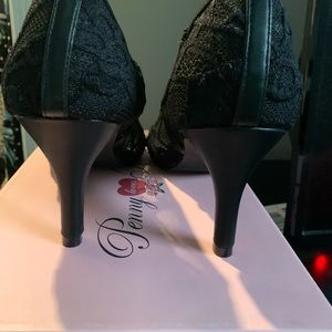 Black lace pumps